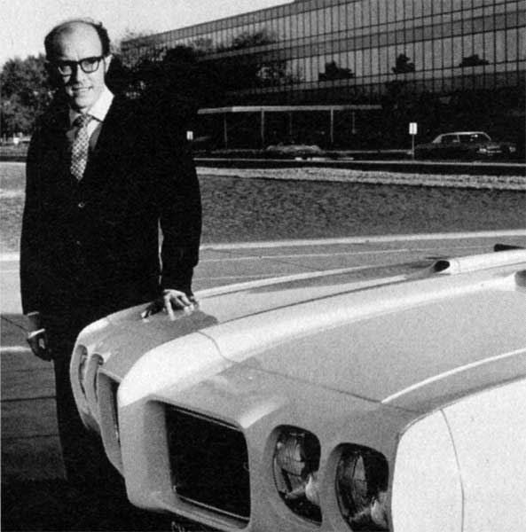 Bill Porter standing next to a 1970s GTO model GM Archives 4