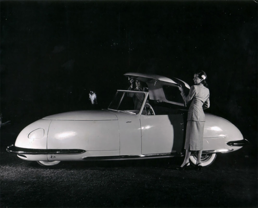 A woman lifting the top of a Davis automobile RESIZED 7