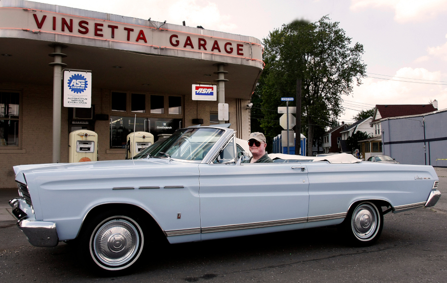 Davis at the wheel in front of the Vinsetta Garage RESIZED