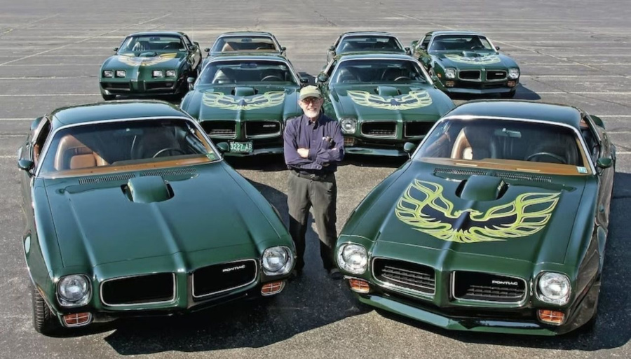 Bill Porter standing with 1970s Firebird models RESIZED 4