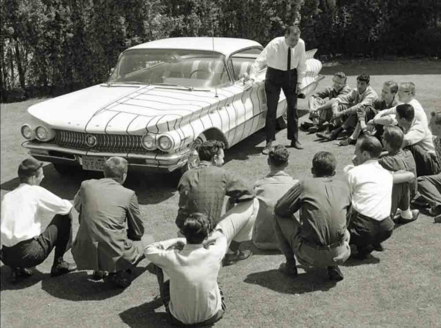 MacMinn teaching design students about the lines on a 1960 Buick Art Center College of Design RESIZED 2