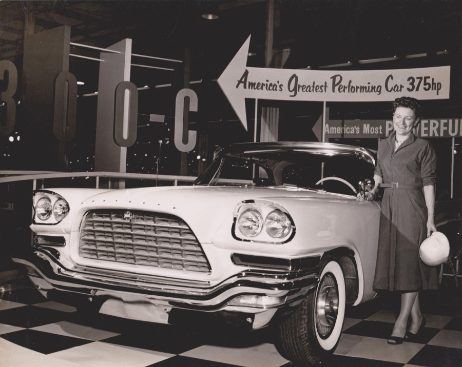 Vicki Wood standing with a 1957 Chrysler 300 Jalopy Journal 3 RESIZED
