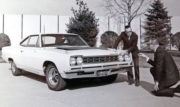 Jack Smith discussing the front end of the Plymouth Road Runner with Chrysler EVP Dick MacAdam 3