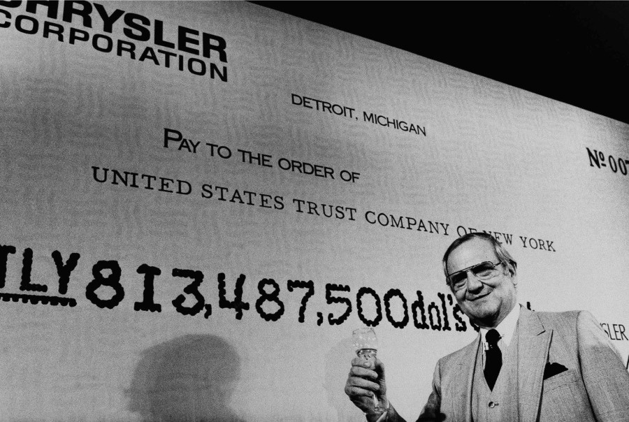 Resized Lee Iacocca with check paying off government loan to Chrysler Auto News 7