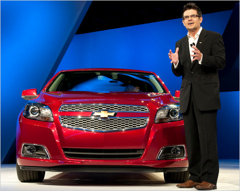 Nesbitt standing in front of a Chevrolet General Motors Heritage Archives 4